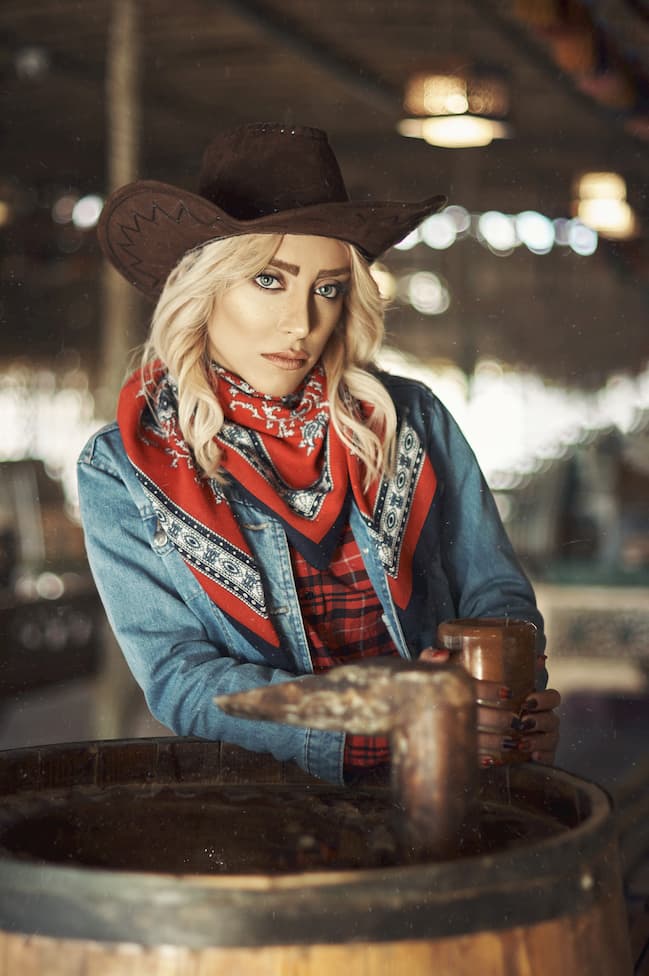 girl with western jacket cowboy hat and red scarf