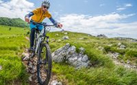 person on the mountain with an electric mountain bicycle