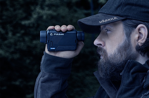 man using Pulsar thermal monocular
