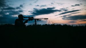 man hunting at night
